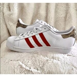 Adidas White Sneakers with Red Stripes and Snake Accent